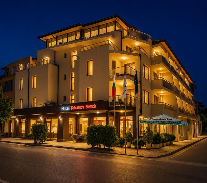 a hotel building with a sign that reads recovery hotel at Tabanov Beach Hotel in Sozopol