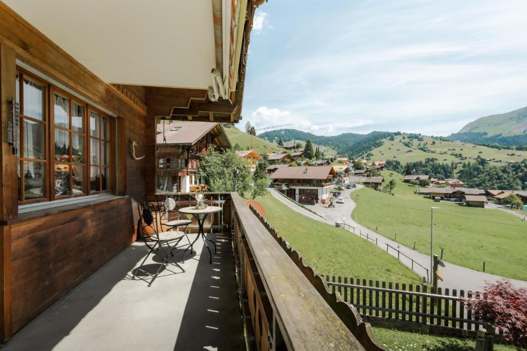 a balcony with a view of the mountains at Alpine Apartment by Carista Homes in Habkern