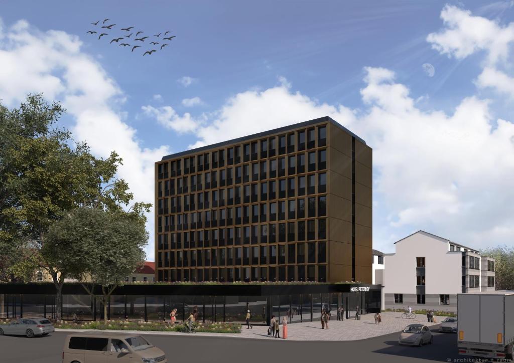 a group of planes flying over a building at Hotel Peterhof - REOPENING November 2026 in Kempten