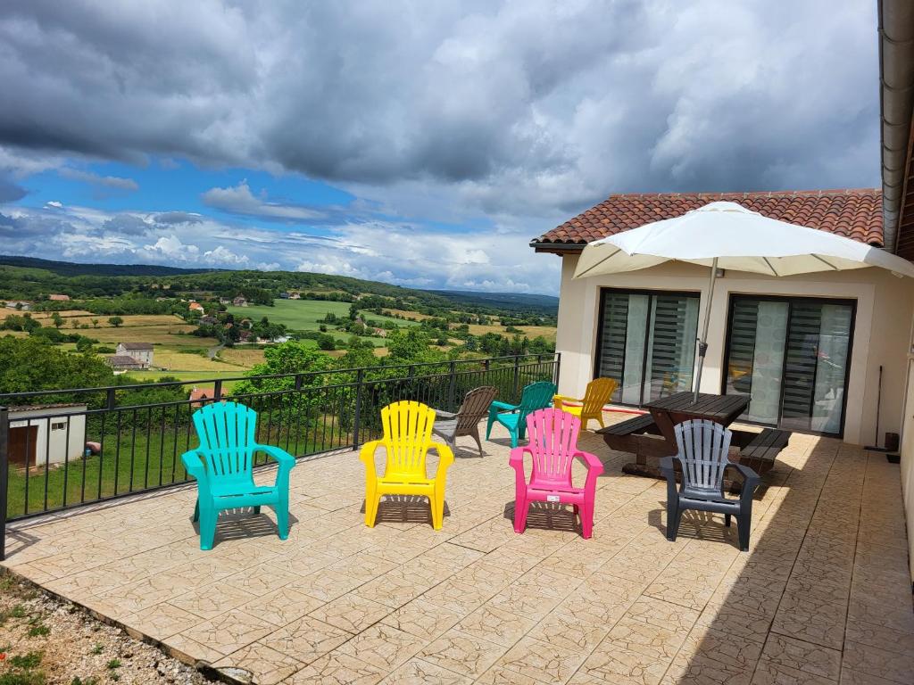 a group of colorful chairs sitting on a patio at Belle Villa 160 in Blars