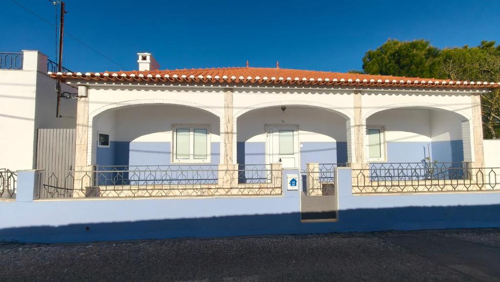 a white building with arches on the side of it at Alentejo Colours Cano in Cano