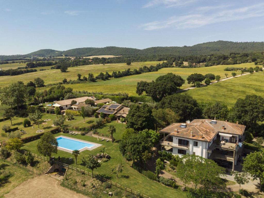 an aerial view of a house with a swimming pool in a field at Holiday Home Rosalba Bacara by Interhome in Bolsena