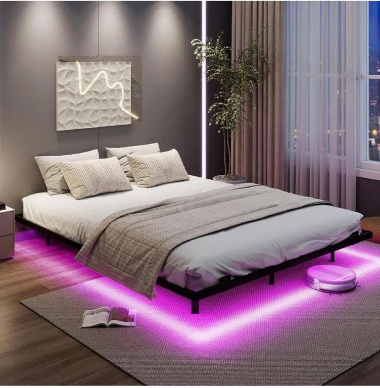 a bedroom with a large bed with purple lights at Relax Rooms in Trapani