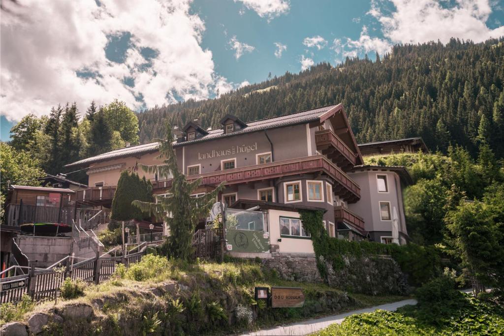a large building on the side of a mountain at Landhaus am Hügel in Bad Gastein