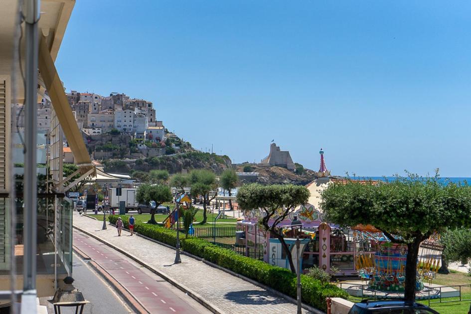 a view of a city with a hill in the background at Casa Canzatora in Sperlonga