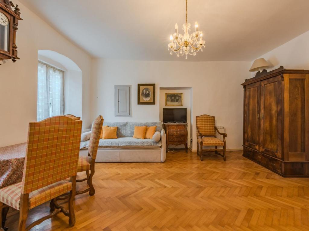 a living room with a couch and a table at Apartment Catherine by Interhome in Pellizzano