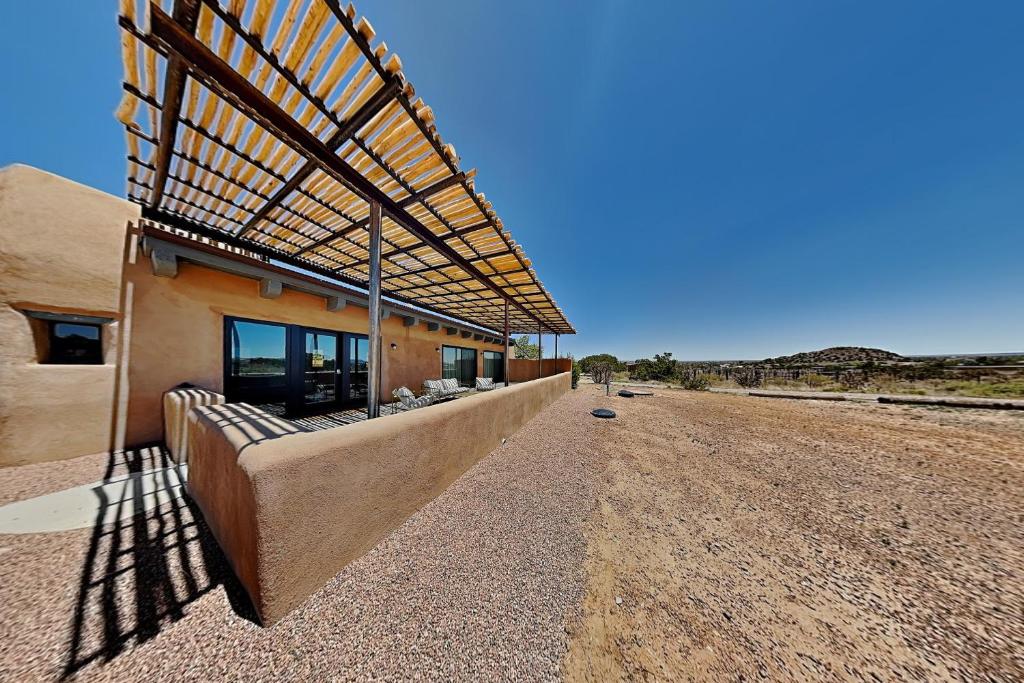 a building on the side of a dirt road at Five Ravens in Santa Fe