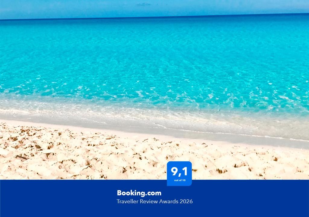 a picture of a beach with a blue ocean at Apartalux Villa Playa in Benidorm
