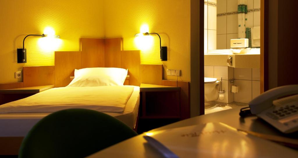 Voodi või voodid majutusasutuse Hotel Rio toas