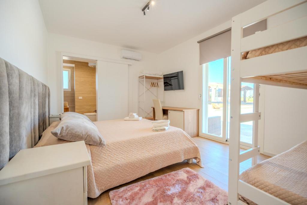 a bedroom with a bed and a bunk bed at Tenuta Bruni - Agriturismo & Pool in Squinzano