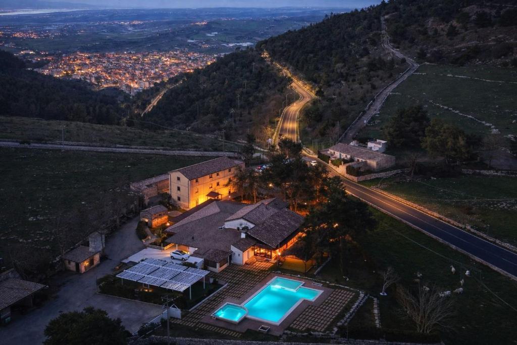 an aerial view of a house with a swimming pool at Antica Stazione in Chiaramonte Gulfi