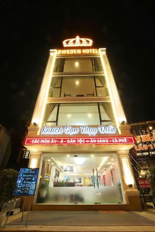 a building with a sign on top of it at Sweden SaPa Hotel in Sapa