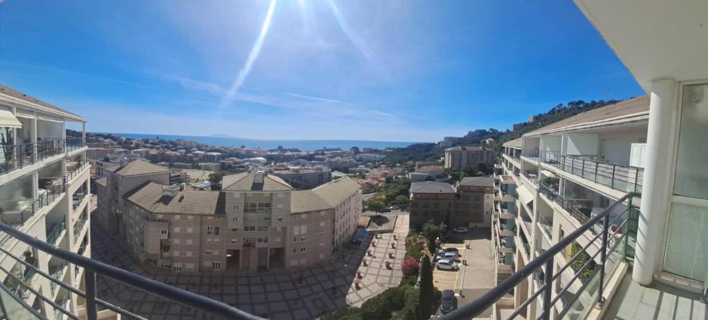 a view of a city from the balcony of a building at Studio climatisé avec vue mer in Bastia