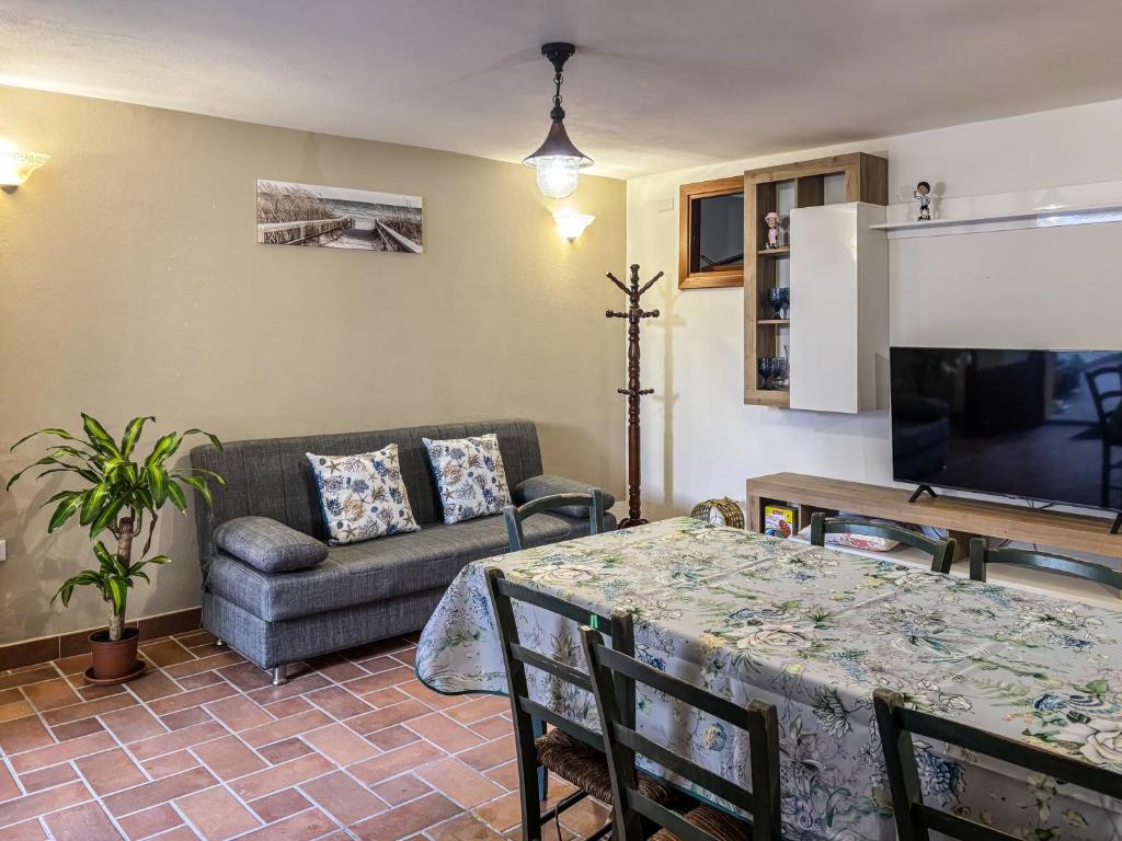 a living room with a table and a couch at Villa GioCar in Castelsardo