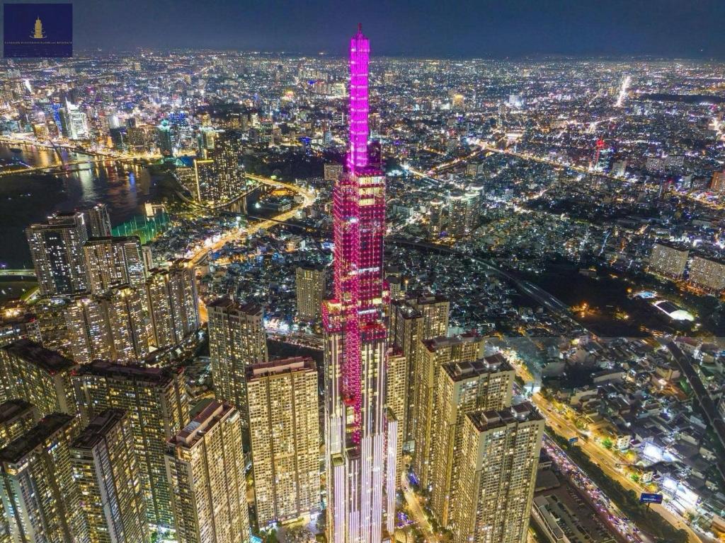 an aerial view of the skyscrapers at night at Landmark 81 Exclusive Panorama Residence in Ho Chi Minh City