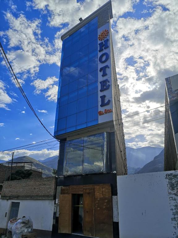 a building with a sign on the side of it at Hotel el sol Caraz in Caraz