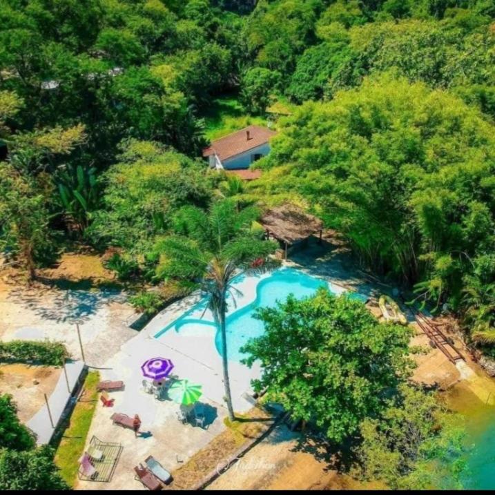 an overhead view of a swimming pool with a resort at Ibiza Experience Resort in Angra dos Reis
