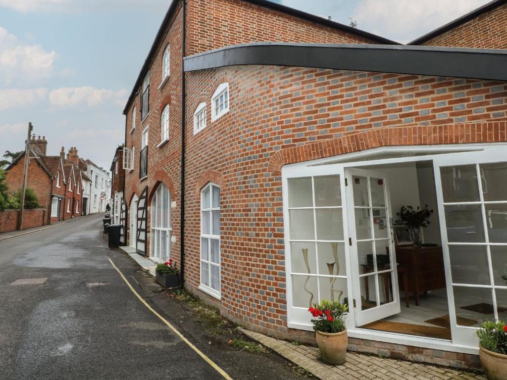 a brick building with white doors on a street at 2 Bed in Southampton