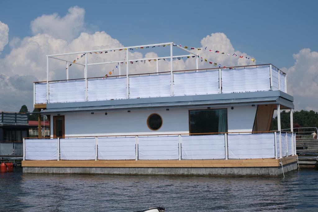 a large boat is docked on the water at Unique floating retreat Sleeps 4 in Sölvesborg