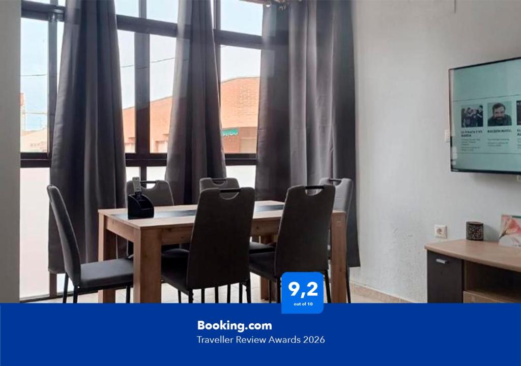 a conference room with a wooden table and chairs at Apartalux San Pedro Mar in San Pedro del Pinatar