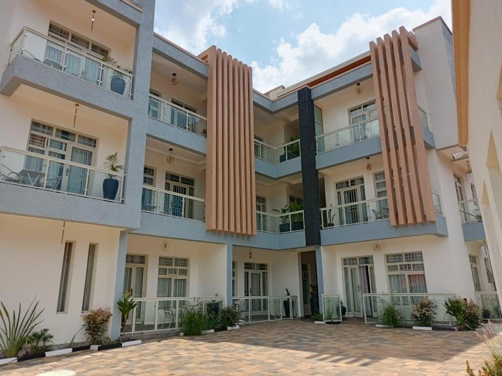 an exterior view of a large apartment building at Peaceful Home in Kigali