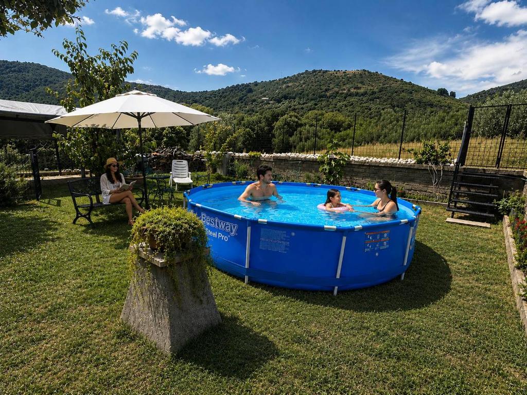 a group of people in a hot tub in a yard at Il Posto delle Rose 2 in San Polo dei Cavalieri