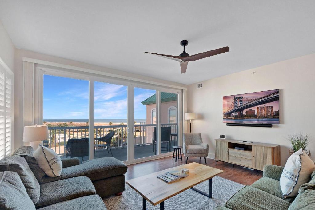 a living room with a couch and a table at St. Simons Grand 307 in Saint Simons Island