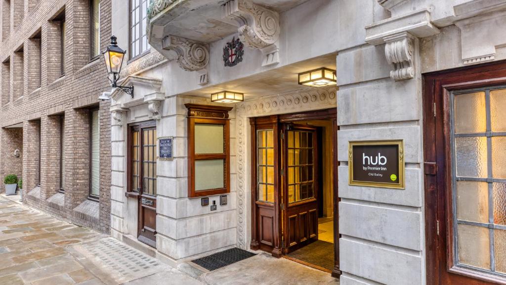 a building with doors and a sign on it at hub London Farringdon - Old Bailey in London