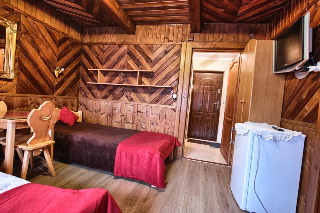 Televízia a/alebo spoločenská miestnosť v ubytovaní Pokoje Gościnne Za Wnukiem