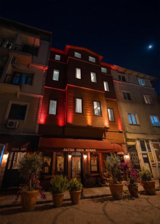 a building with red lights on the side of it at Astro Suites in Istanbul