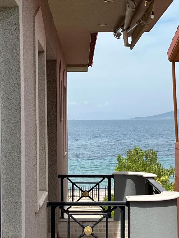 a view of the ocean from the balcony of a house at Stella Maris sea front studios in Kanatádhika