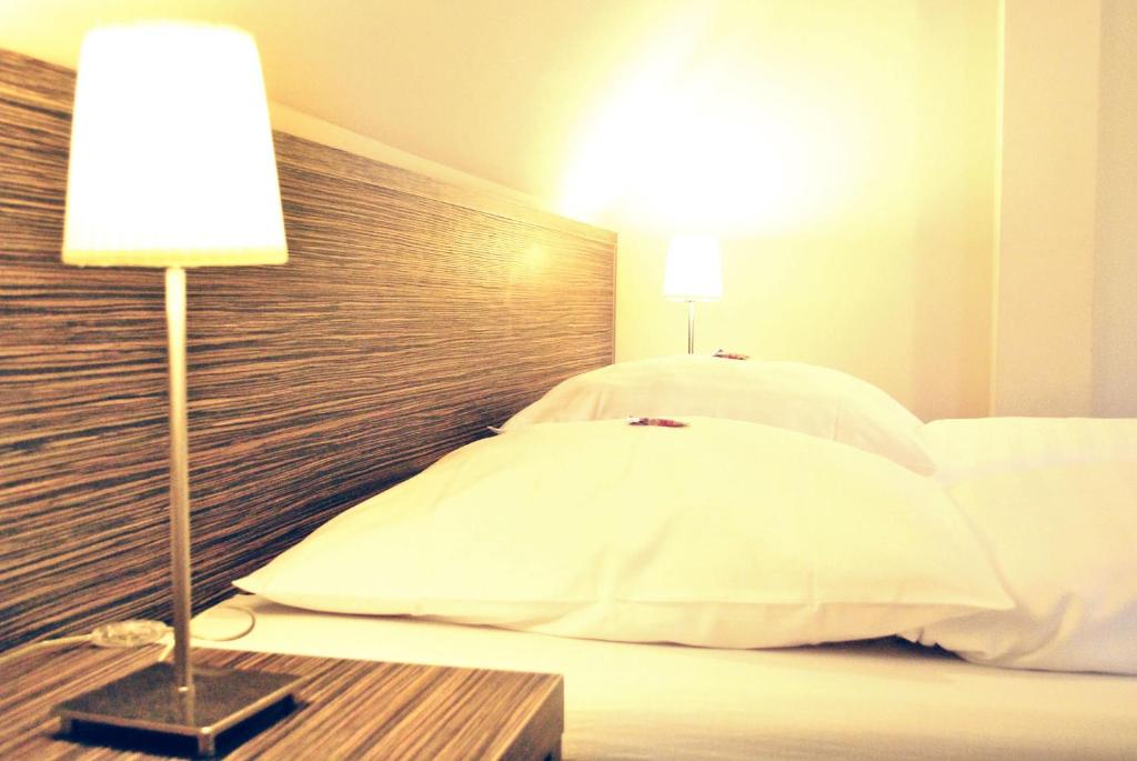 Postel nebo postele na pokoji v ubytování Hotel Dietrichsdorfer Hof