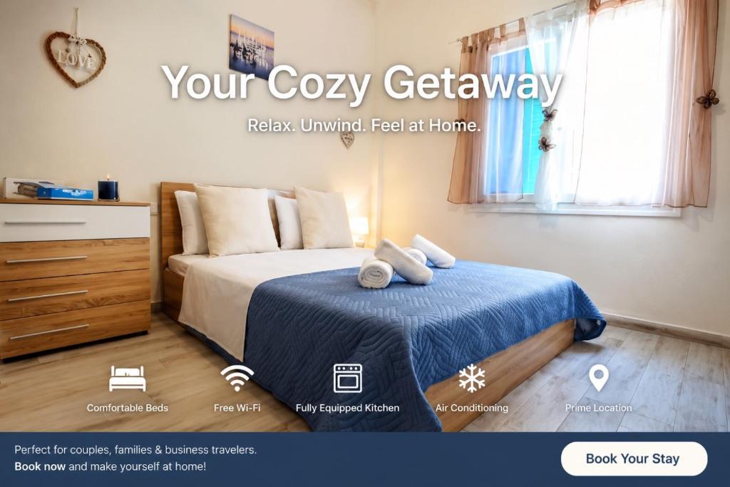 a bedroom with a bed with a blue blanket at Blue Sea Y in Kavála