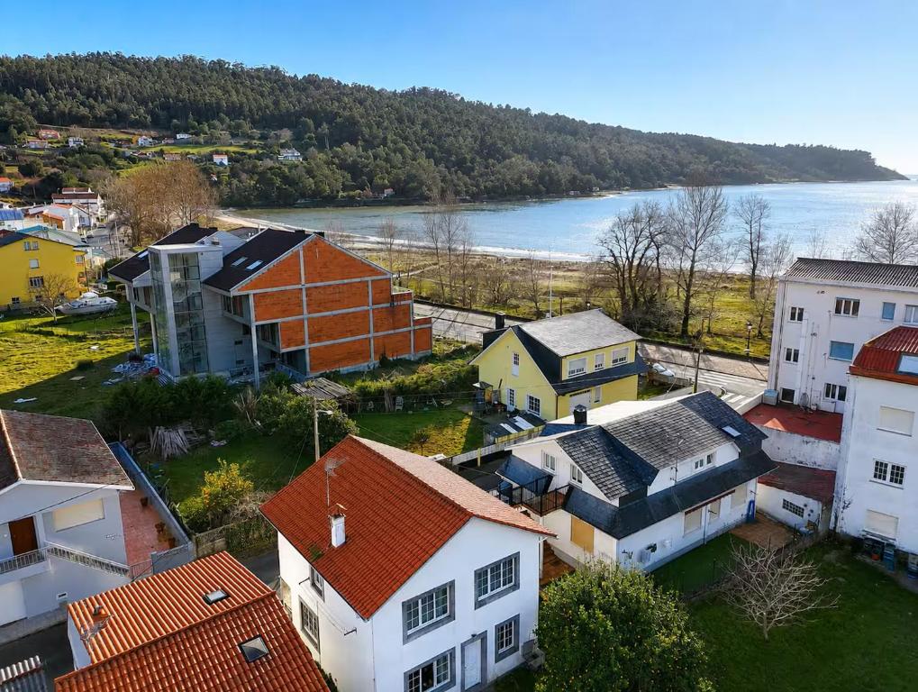an aerial view of a town with a river and houses at Airtegal Casa da Praia Cedeira in Cedeira