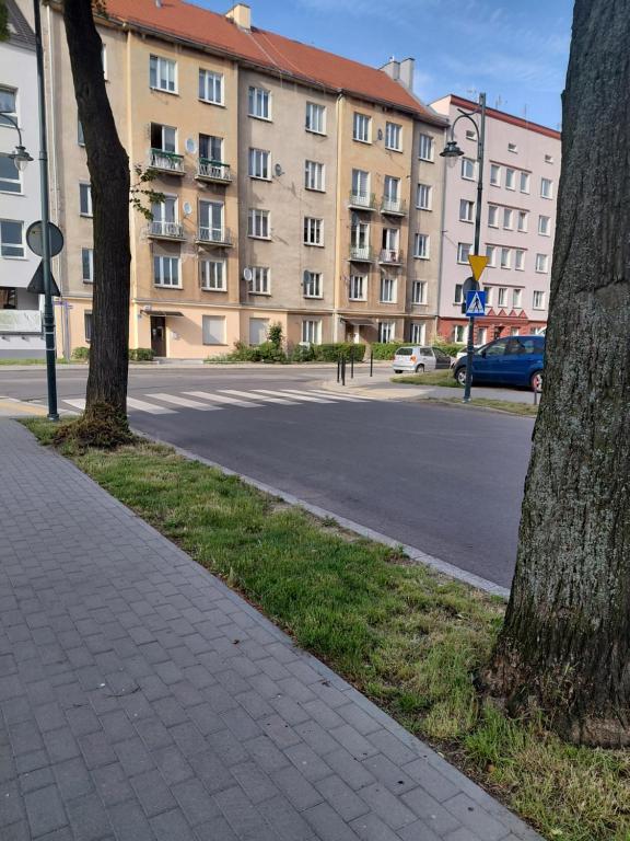 an empty street in front of a large building at Kawalerka nad Odrą in Brzeg