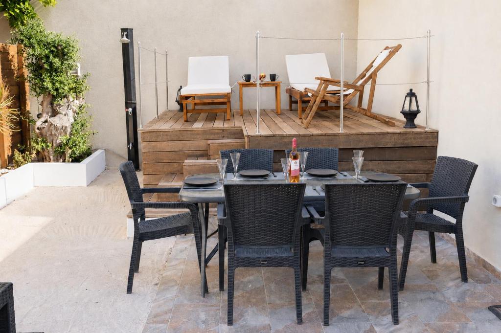 a table and chairs sitting on a patio at 9-4 Private Houses in Kos