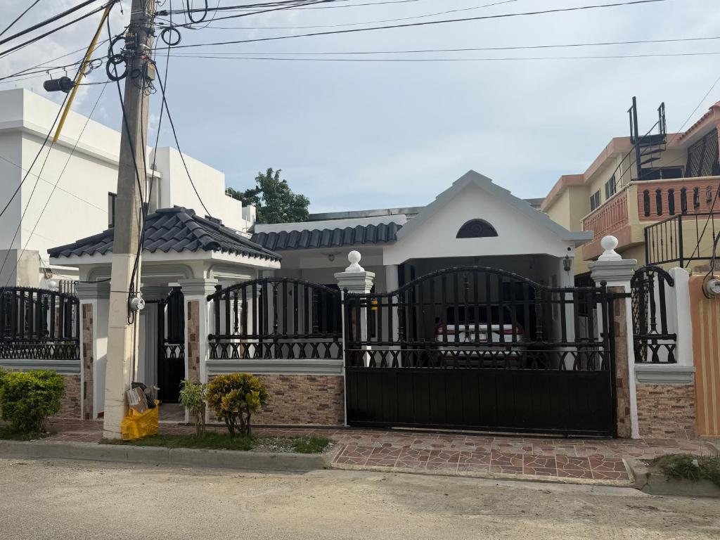 a black gate in front of a house at Mary Vilaseca in SJM