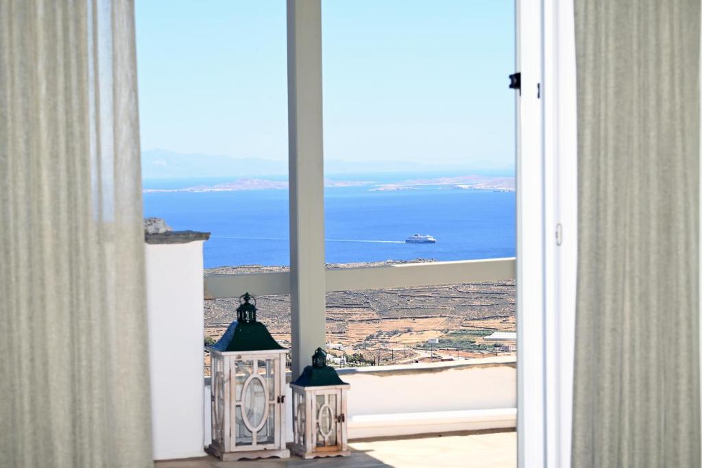 an open door with a view of the ocean at Anastasia Home in Triandáros