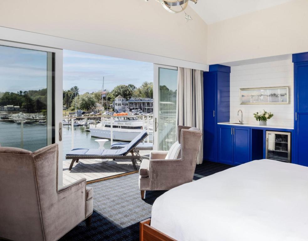 a bedroom with a bed and a view of a marina at The Boathouse in Kennebunkport