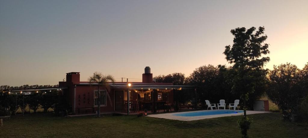 a house with a swimming pool in the yard at La Elvira in San Pedro