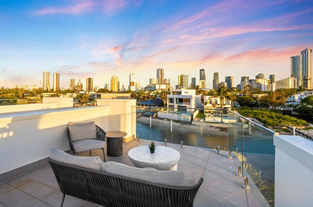 a balcony with a view of a city skyline at Wanderlust heated pool rooftop deck in Gold Coast