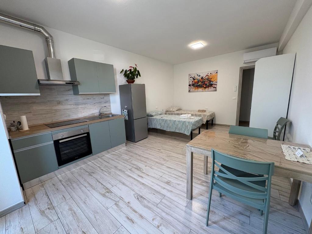 a kitchen with a table and a dining room at Riposati e Riparti in San Piero a Sieve