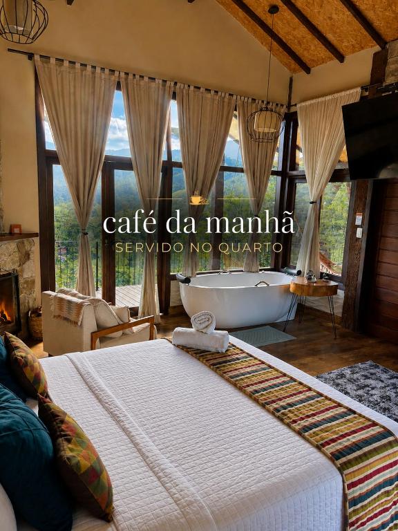 a bedroom with a bed and a tub in a room at Reserva Mauá chalés in Visconde De Maua