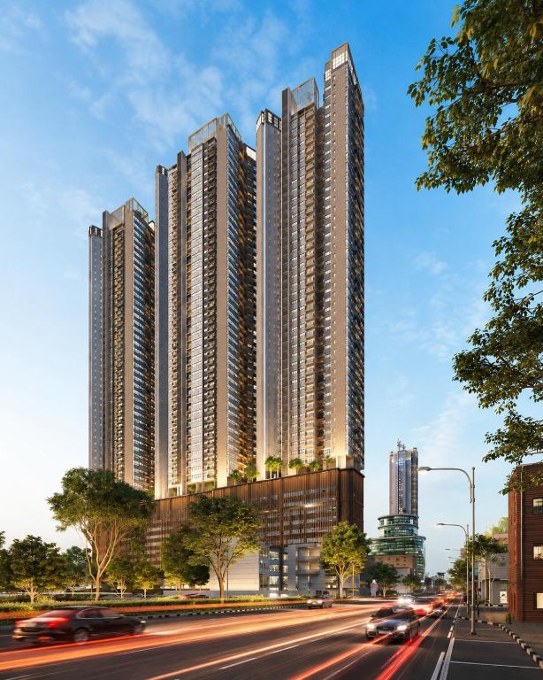 a rendering of a tall building with cars in the street at YAKA Residences - Trizen Luxury Apartments in Colombo