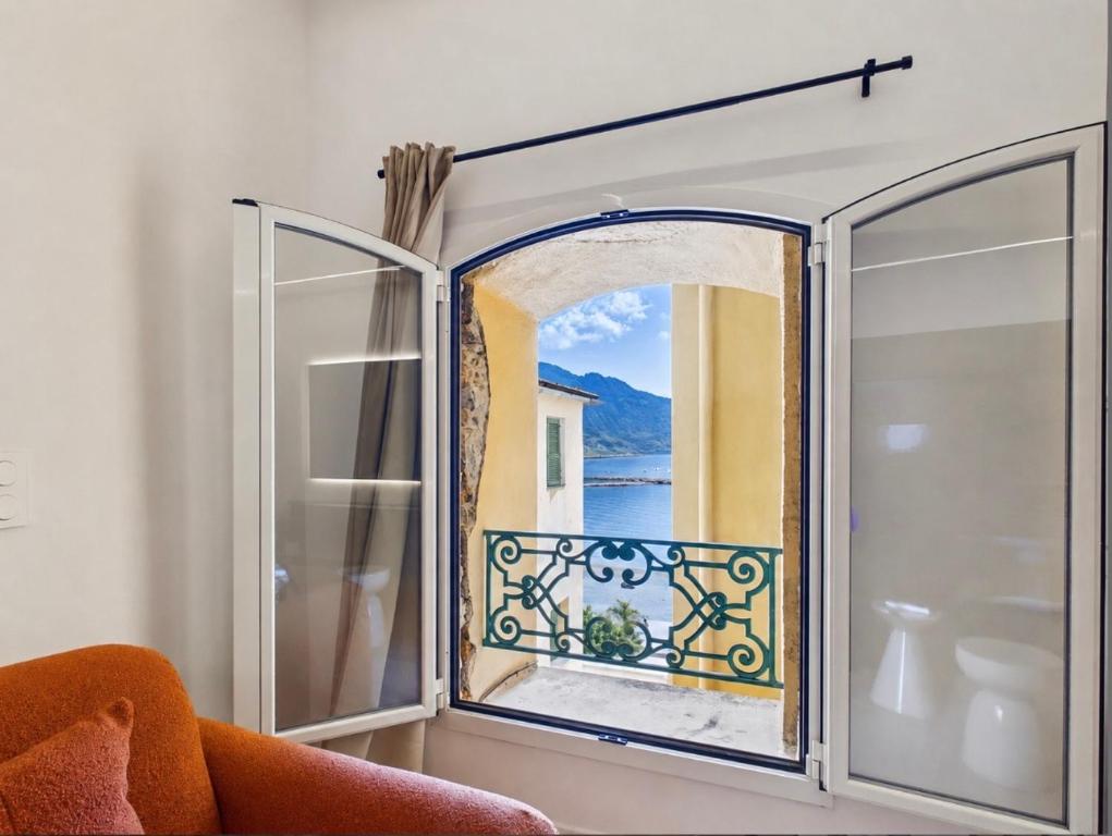 an open window with a view of the ocean at Monaco - Menton Old Town - Climatisation - Seaview - Luxury rénovation in Menton
