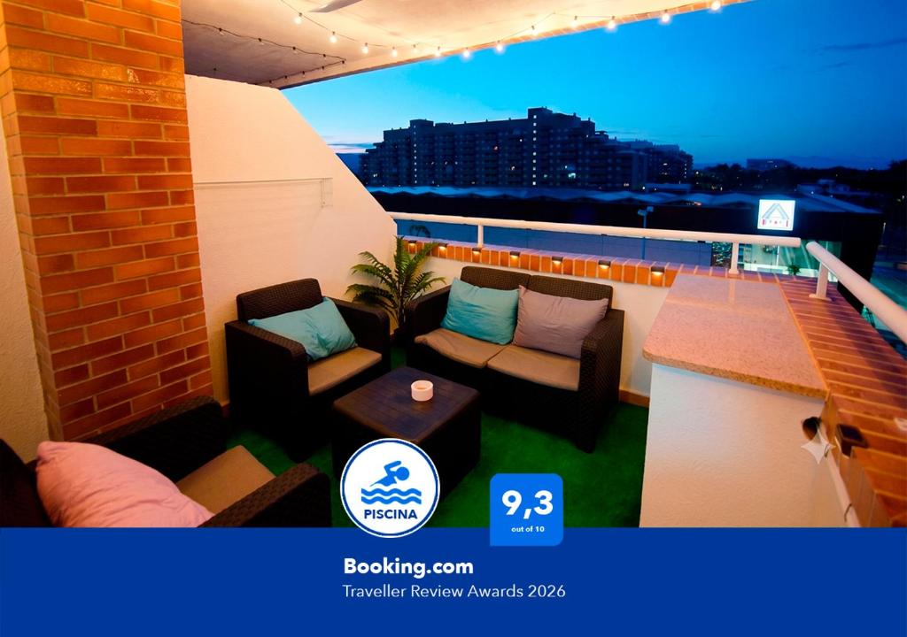 a balcony with couches and a table on a building at Apartalux Magic Diamond in Oropesa del Mar