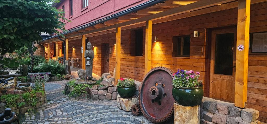 a building with a large wheel on the side of it at Aparthotel & Seminarhaus Wolkentor in Halle an der Saale