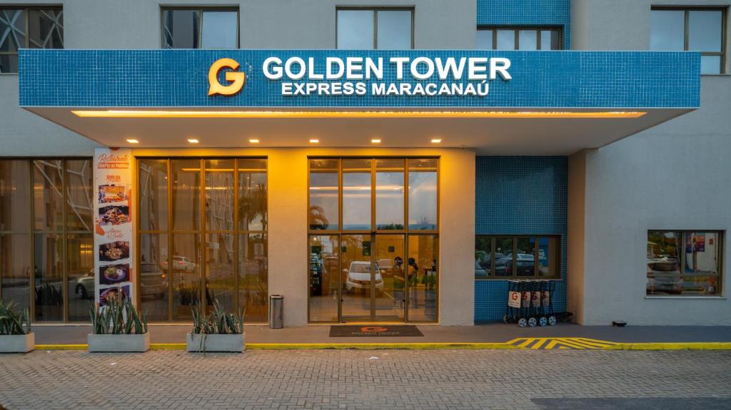 a building with a golden tower express marriott at Golden Tower Maracanaú by Fênix Hotéis in Maracanaú