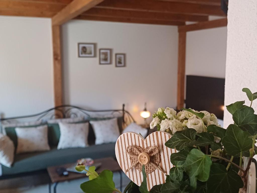 a living room with a heart vase and a couch at Terra Verde in Omiš