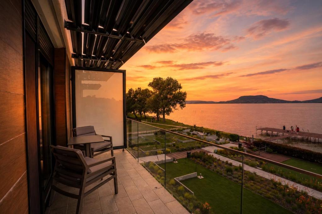 a balcony of a building with a view of the water at Sunset Resort 217 in Fonyód